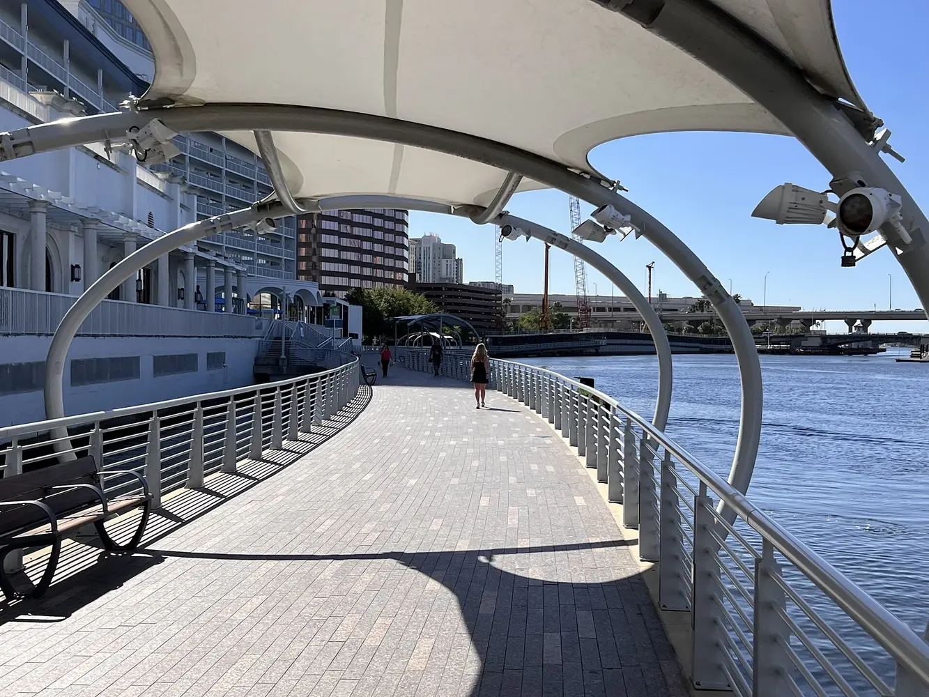 Shaded pedestrian path beside the water on the Tampa Riverwalk